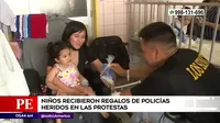 Niños recibieron regalos de policías heridos en protestas